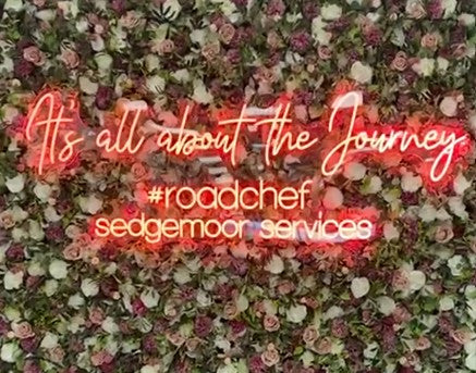 retail & pop-up neon sign case studies branded neon sign Its all about the journey LED neon floral wall retail activation display Roadchef services