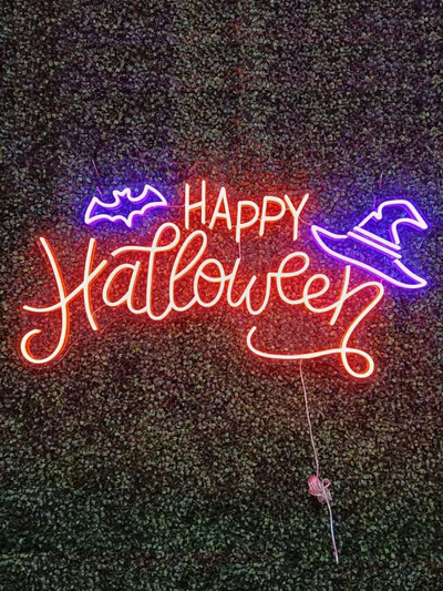 Halloween neon sign display in UK home doorway ambient glow