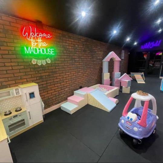 Happy family home featuring a Neon Now kids neon sign