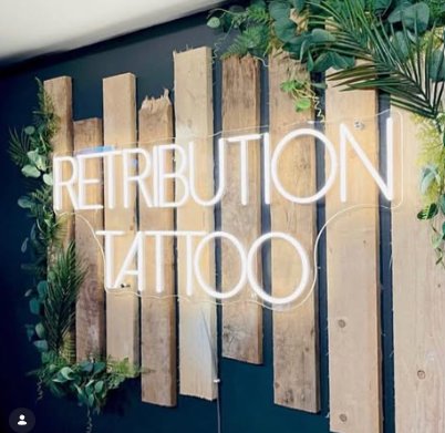tattoo studio neon sign case studies tattoo studio neon sign Retribution Tattoo LED neon wall branding wood panel feature studio interior display