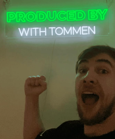 influencer & podcast neon sign case studies content creator neon sign Produced by With Tommen LED neon branding wall YouTube podcast setup display