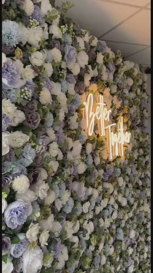 Custom Wedding Neon Sign saying Better Together on a Flower Wall Backdrop from the Midlands Flower Wall Company